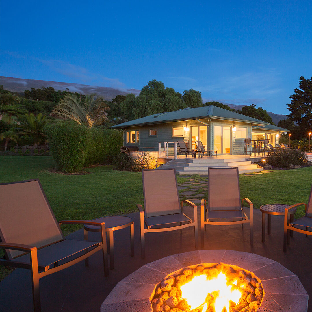 Lovely backyard at night with a fire pit